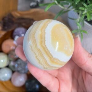 Yellow and White Onyx Sphere. Banded Calcite